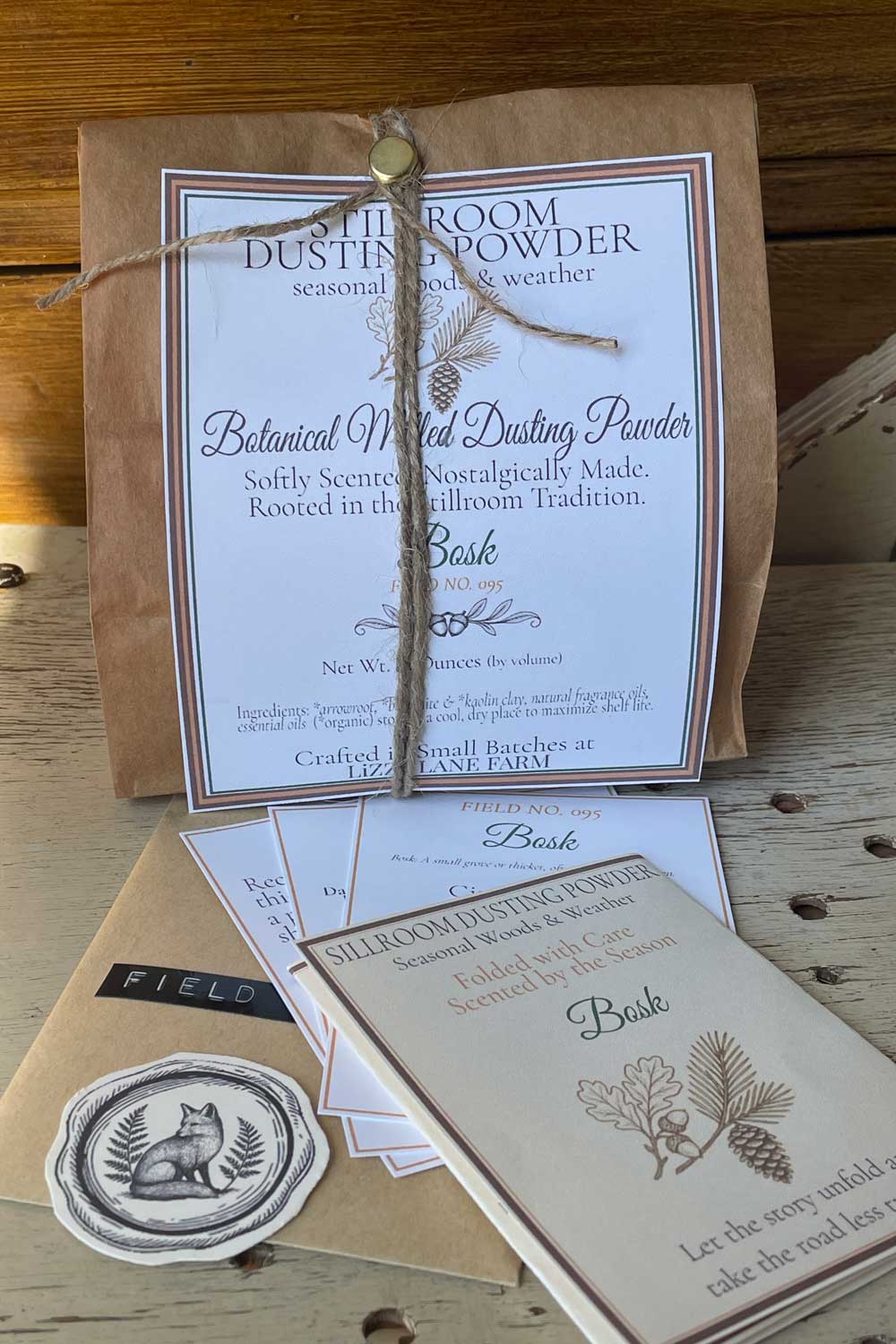 Botanical Milled Dusting Powder Fall Seasonal Woods & Weather Collection- Bosk 12 oz Bulk Packaging with Archival Cards resting on natural wood