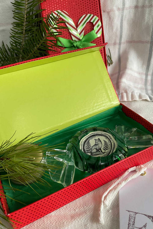 Vintage glass tealight holder packaged in festive red and green gift box with pine sprigs, ready for Christmas gifting. Cottage-core holiday candle gift from Lizzy Lane Farm.