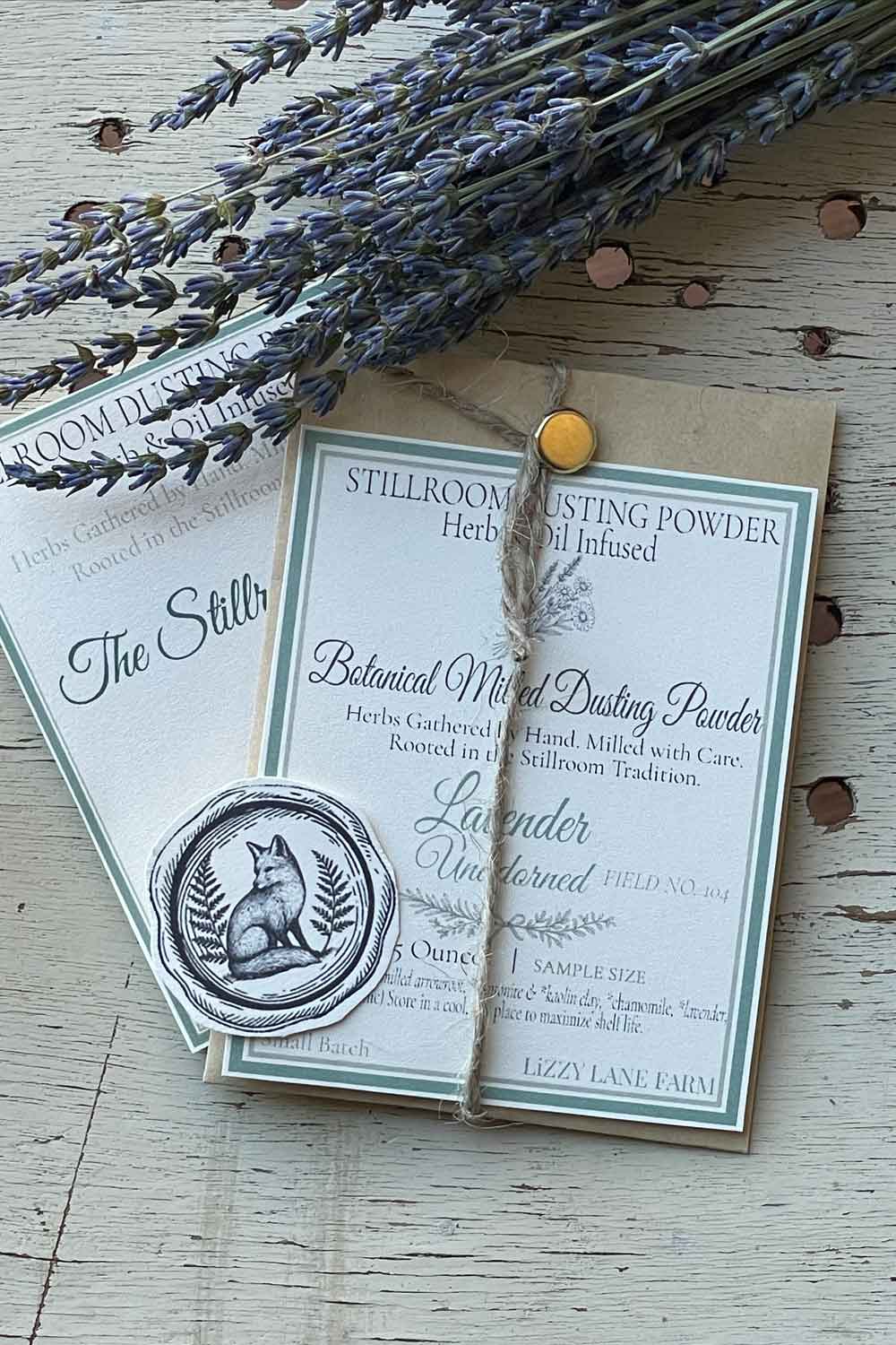 Field No. 104 Lavender Unadorned Dusting Powder — unscented sample in kraft coin envelope with brass clasp, twine, and fox seal. Herb & Oil Infused talc-free body powder, part of the Stillroom Archive Collection.