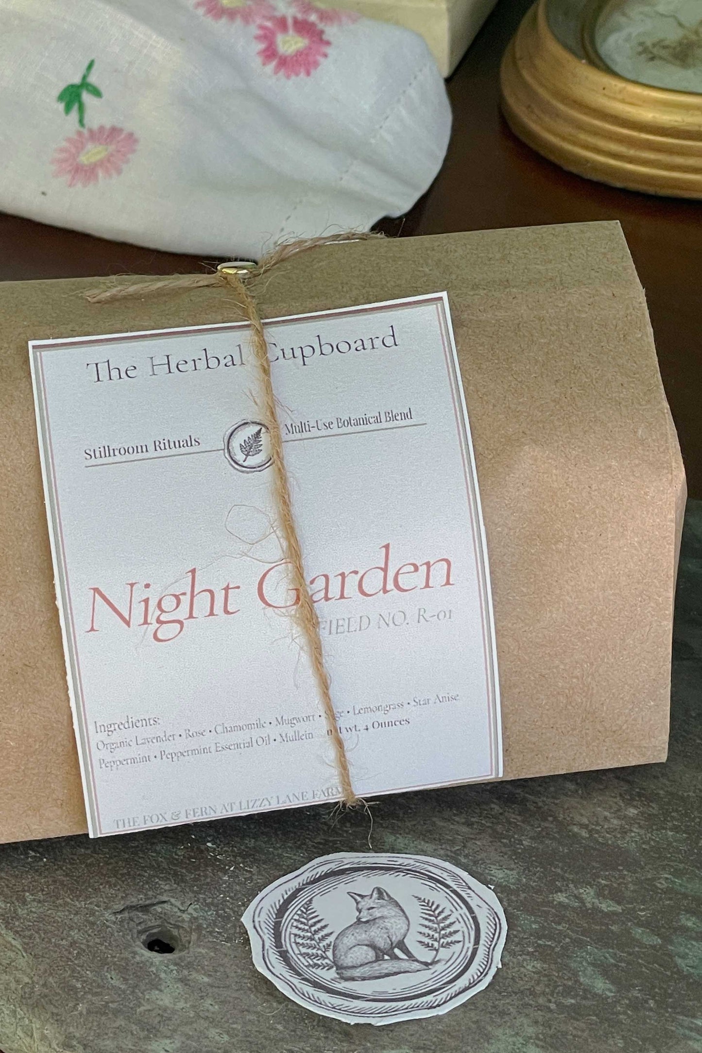 Night Garden herbal blend packaged in kraft paper bag with folded stillroom label and twine tie