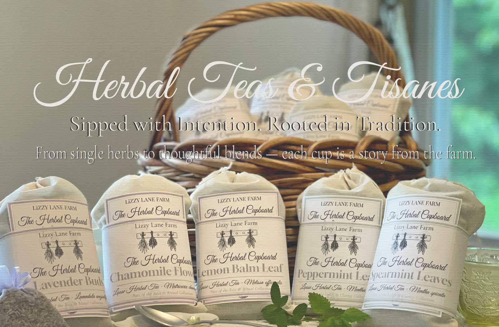 Muslin-wrapped herbal teas in a wicker basket, labeled Lavender, Chamomile, Lemon Balm, Peppermint, and Spearmint. Handcrafted by Lizzy Lane Farm and part of The Herbal Tea Cupboard collection.