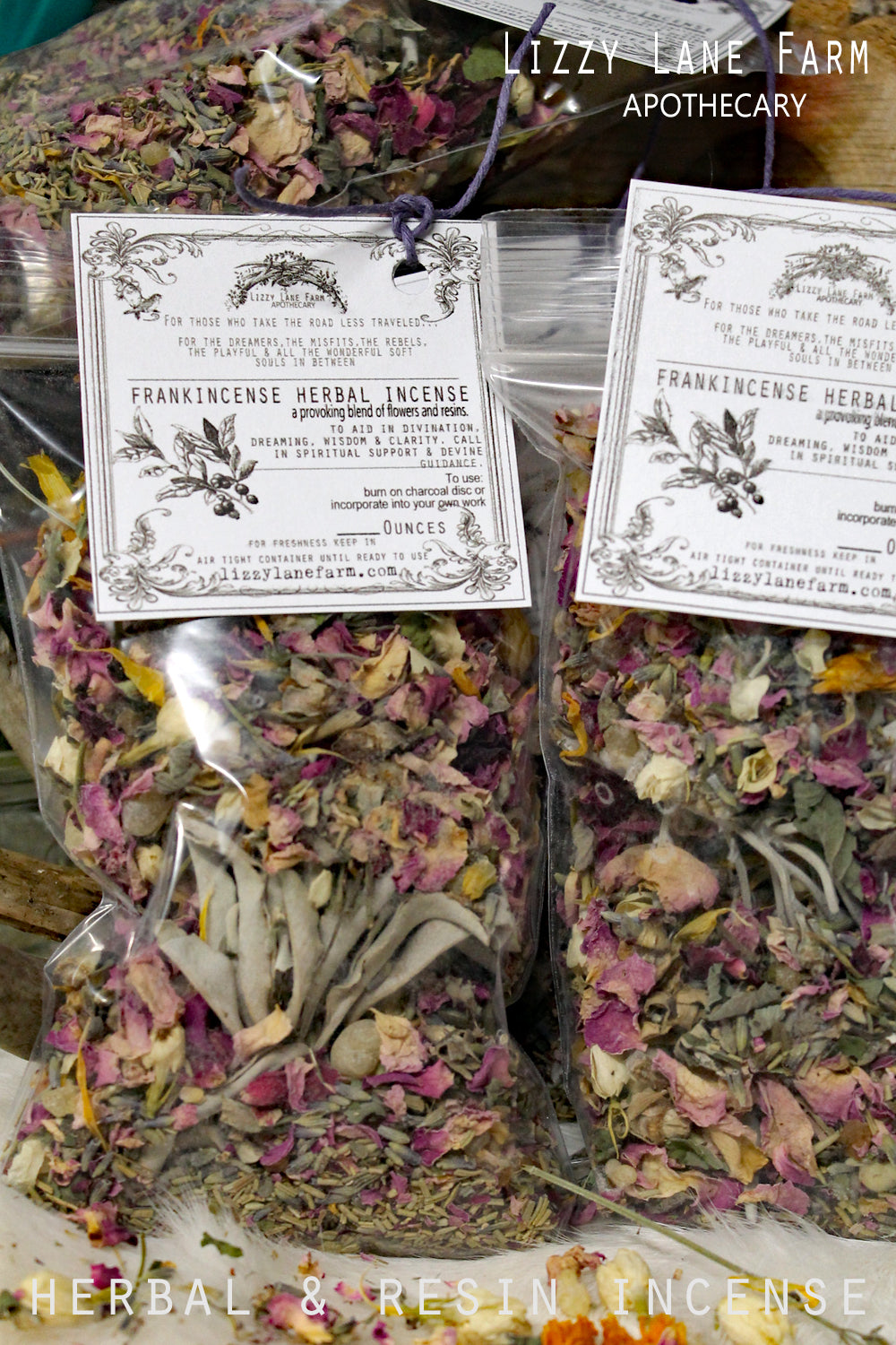 Close-up of two smaller bags of Frolic Herbal Incense, showcasing a vibrant blend of lavender, chamomile, white sage clusters, and natural resins. Each bag features a vintage-inspired apothecary tag, perfect for home fragrance, relaxation, and slow living rituals.