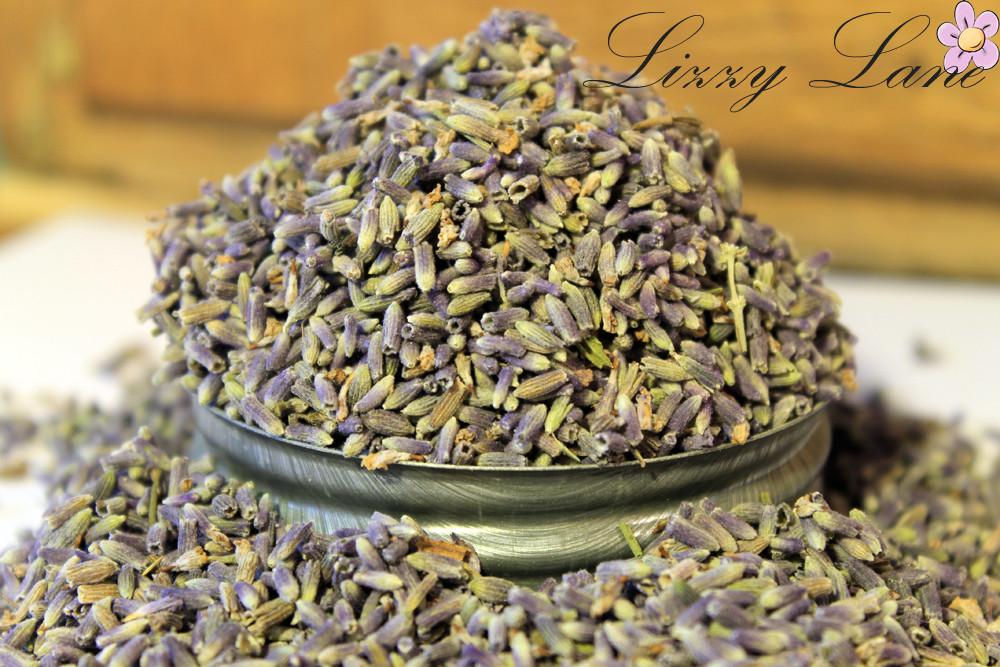 Vintage Mason Jar with Ultra Blue Lavender: A close-up of deep blue lavender buds spilling over the rim of a vintage mason jar with a zinc lid, showcasing the vibrant color and texture of the buds.