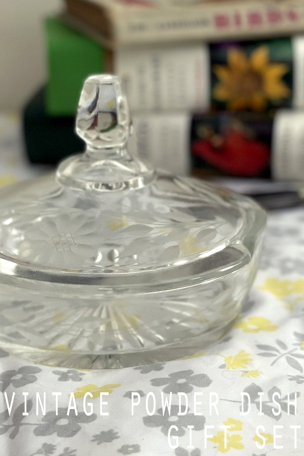 Close-up of etched daisy detail and notched glass edge catching the sunlight.