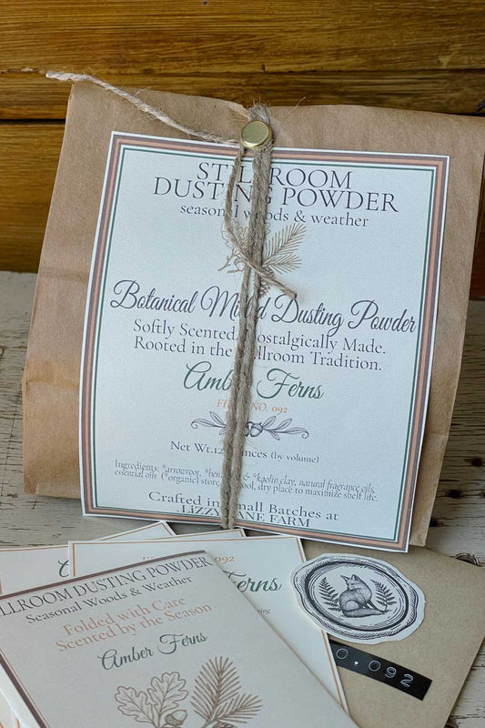 Bulk dusting powder in amber ferns scent with the archive collection cards and archive coin envelope. Part of the Seasonal Woods & Weather Dusting Powder Collection.