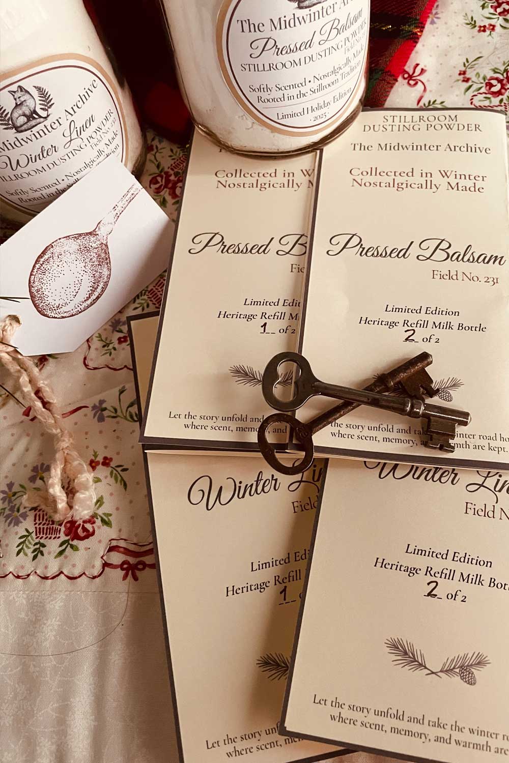 Numbered collectible archive cards for limited-edition dusting powder refills, styled with antique keys for a vintage cottagecore holiday aesthetic
