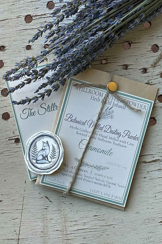 Field No. 105 Chamomile Dusting Powder — sample size in kraft coin envelope with brass clasp, twine, and fox seal. Herb & Oil Infused talc-free body powder, part of the Stillroom Archive Collection.