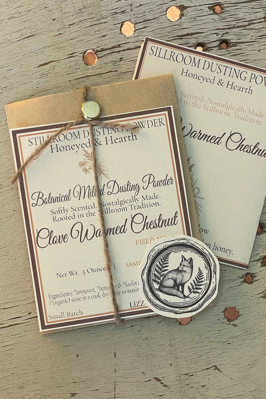Clove-Warmed Chestnut Dusting Powder, 12 oz bulk edition with Stillroom Archive fragment cards — nutty, spiced, evergreen Honeyed & Hearth scent.