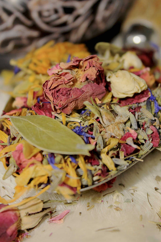 Close-up of Cutting Garden potpourri with dried lavender buds, rose petals, and calendula blossoms.