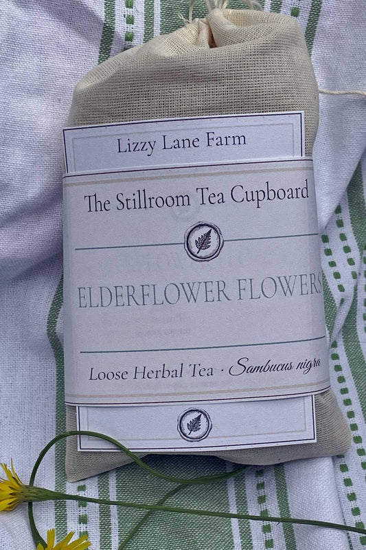 Loose elderflower tea in a muslin bag