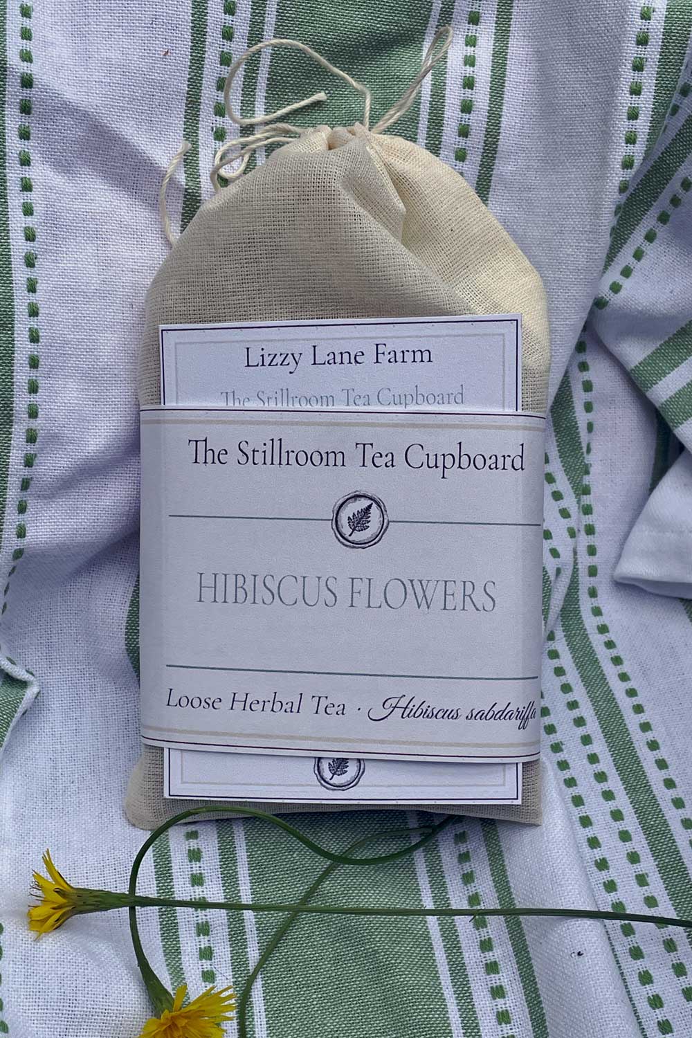 hibiscus flower loos tea in a muslin pouch