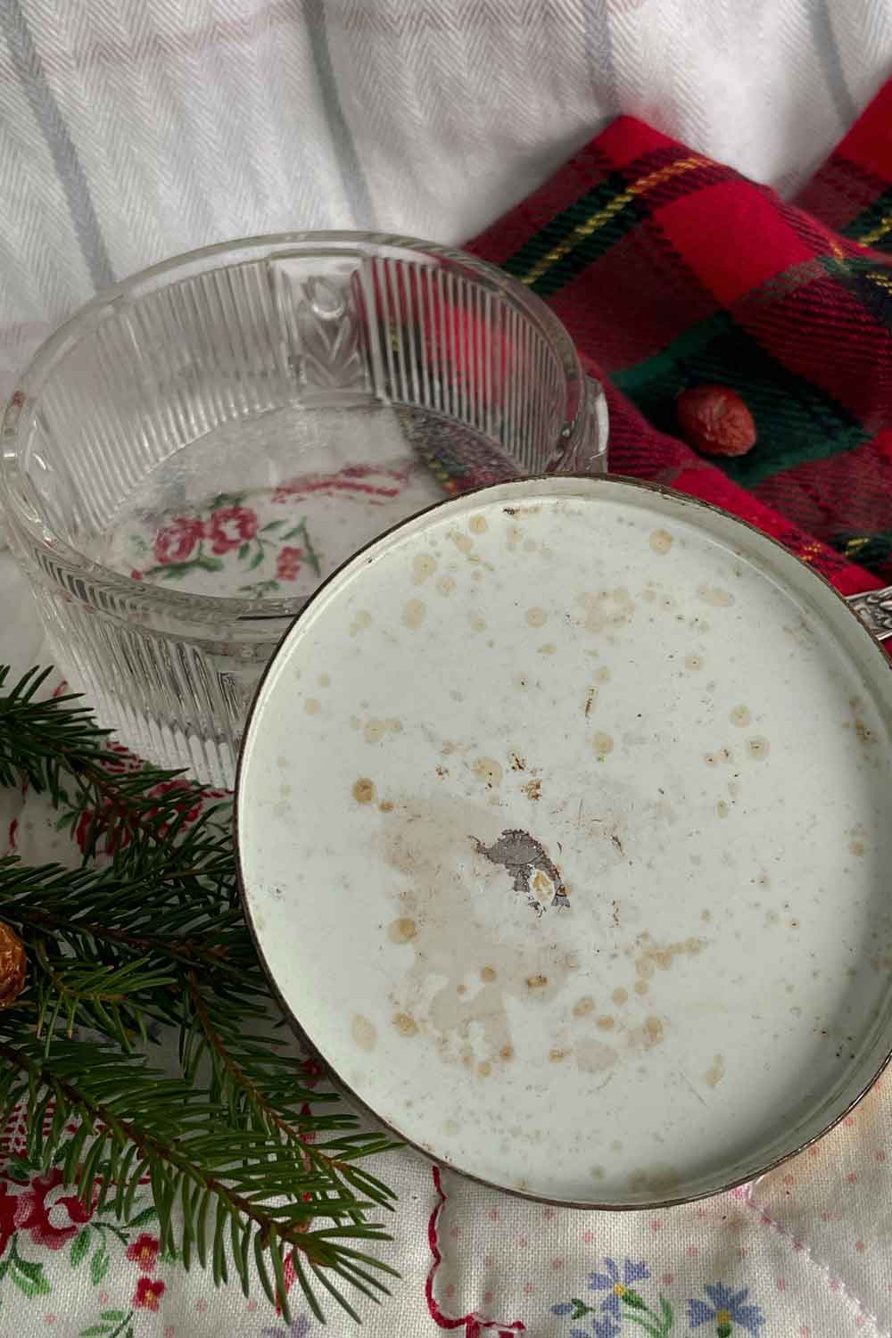 Back of vintage powder dish lid showing authentic age-related patina and spotting, condition disclosure