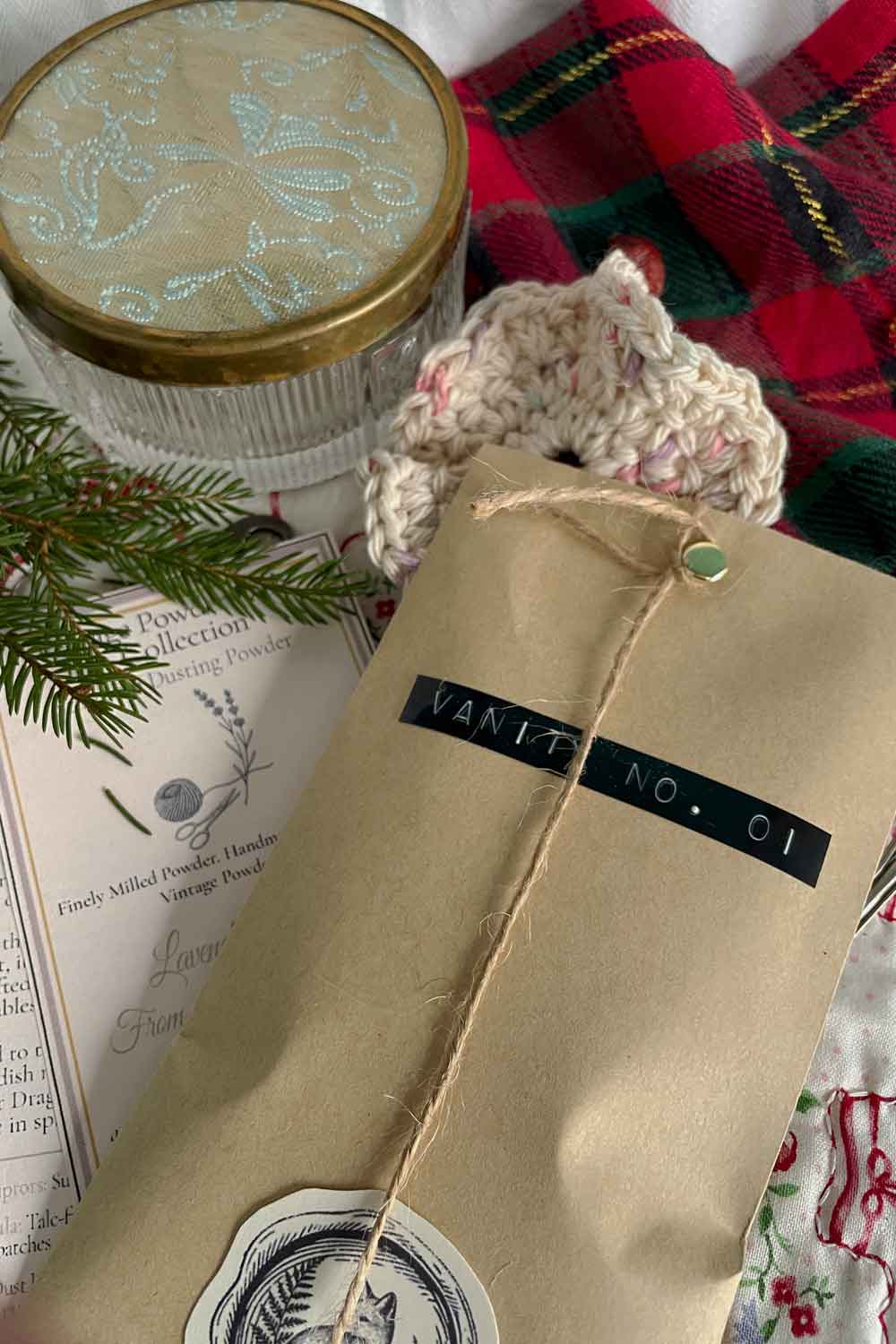 Vintage vanity powder dish with Archive Story Card and aromatic Stillroom Dusting Powder packaging