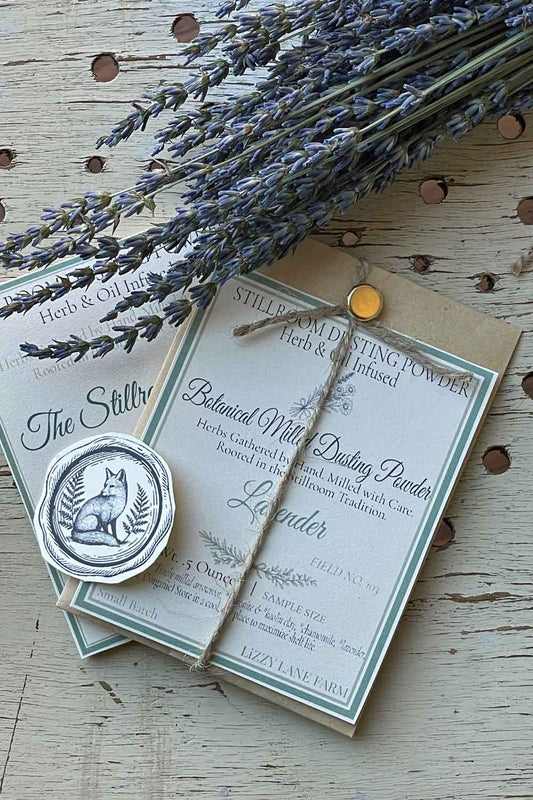 Field No. 103 Herbal Lavender Dusting Powder — sample size in kraft coin envelope with brass clasp, twine, and fox seal. Herb & Oil Infused talc-free body powder, part of the Stillroom Archive Collection.
