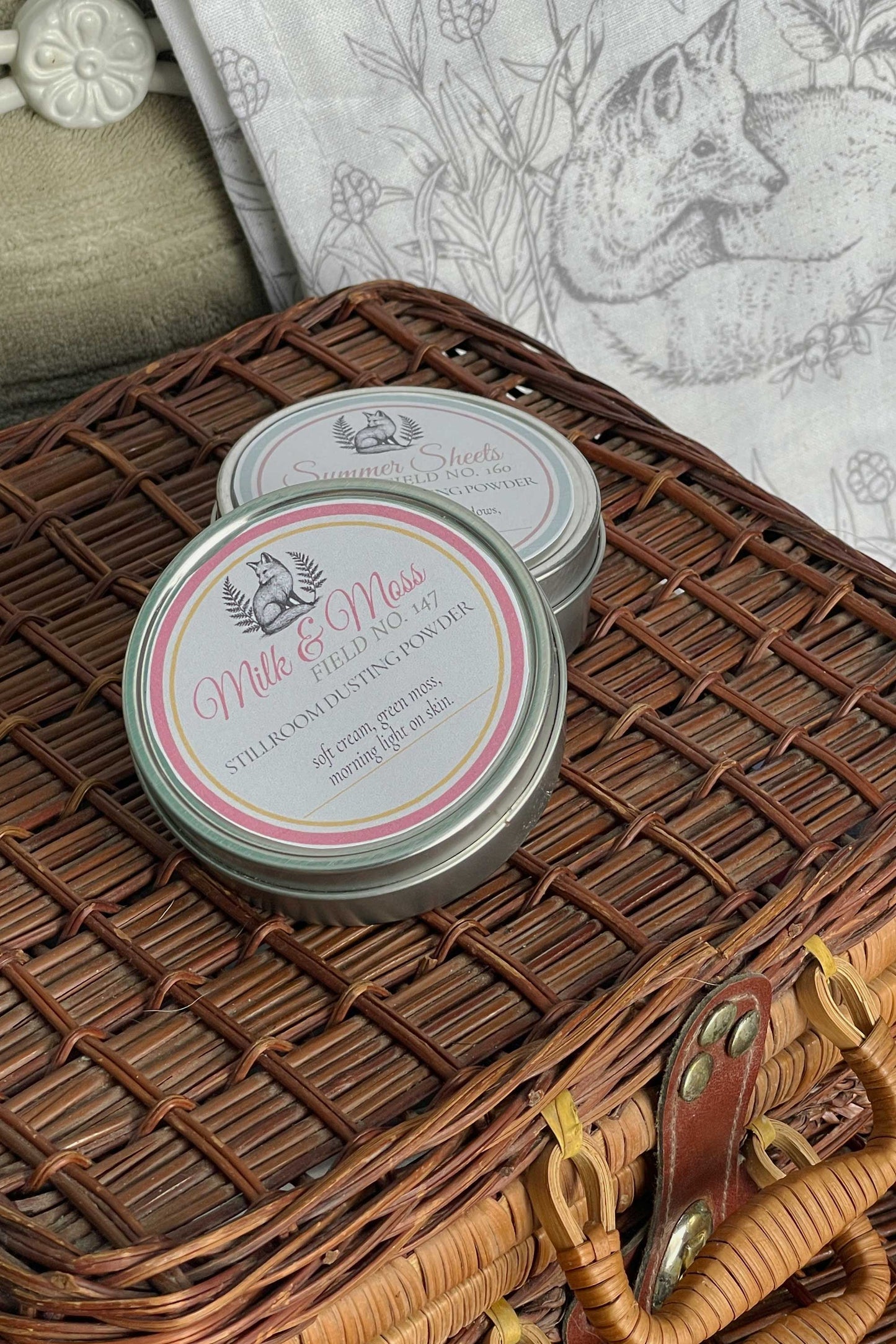 milk & moss and Summer Sheets dusting powder travel tins read to travel