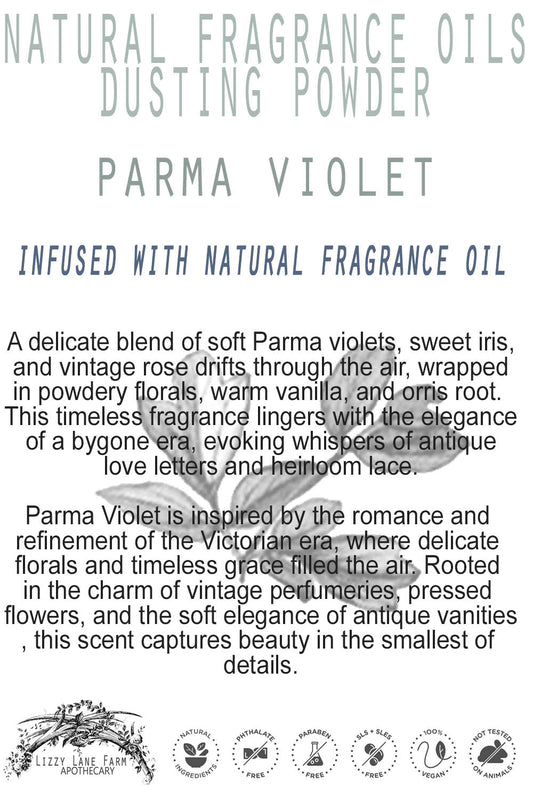 A product card featuring the Parma Violet dusting powder sits gracefully on an antique vanity. Its elegant script and floral imagery reflect the soft, romantic essence of this Victorian-inspired fragrance.