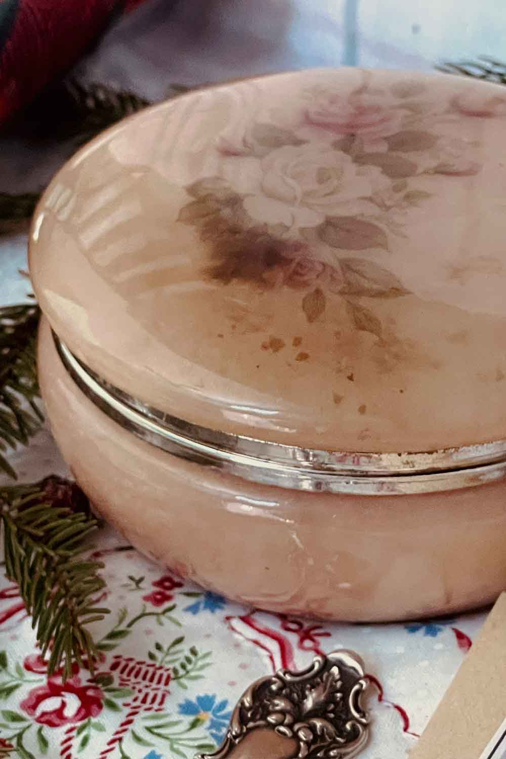 vintage pink alabaster powder dish with rose applique — a holiday-ready Christmas body powder gift, styled on embroidered linen with Stillroom details.