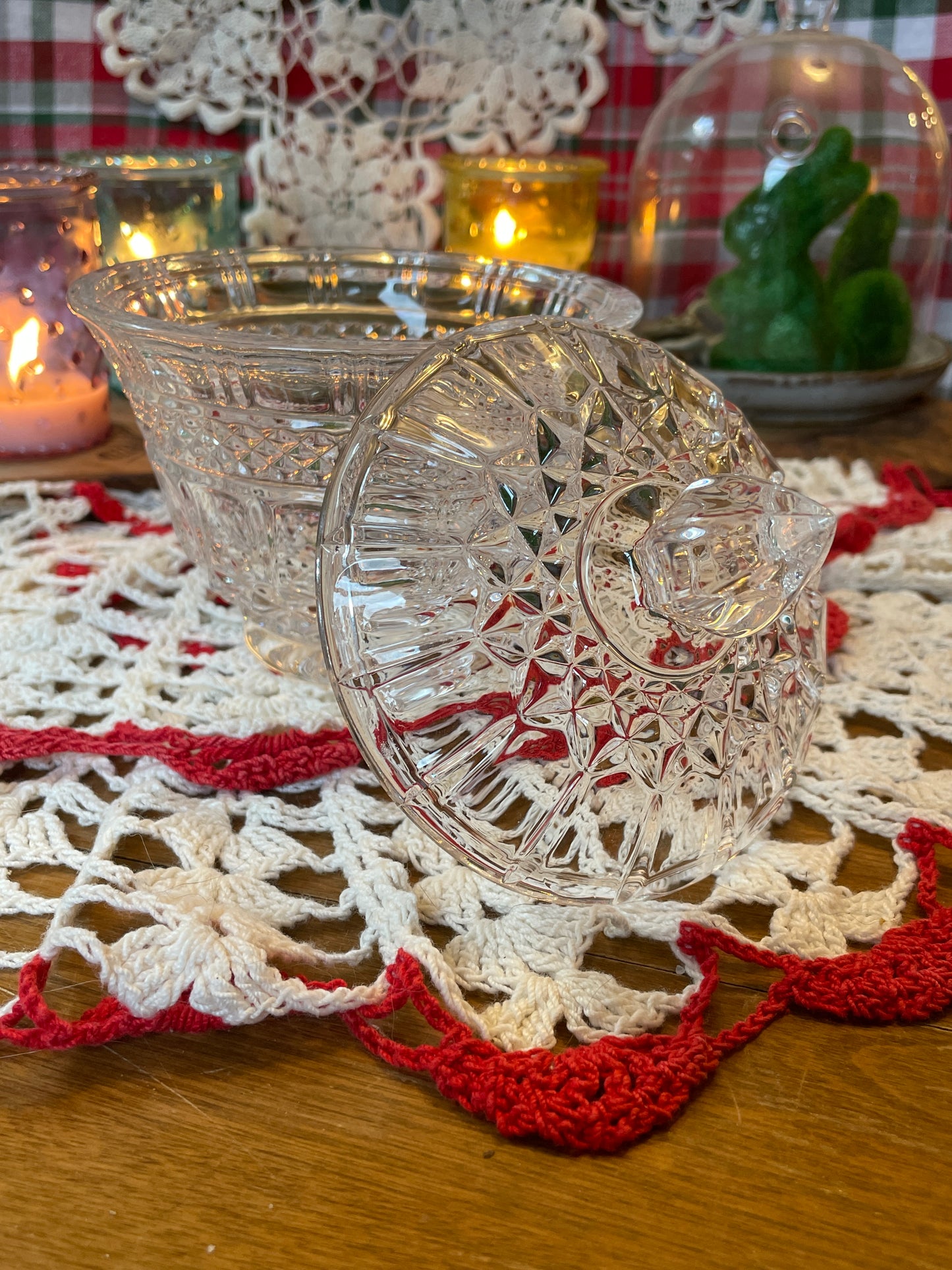 showing off the side view of the cut crystal lid to this powder dish set