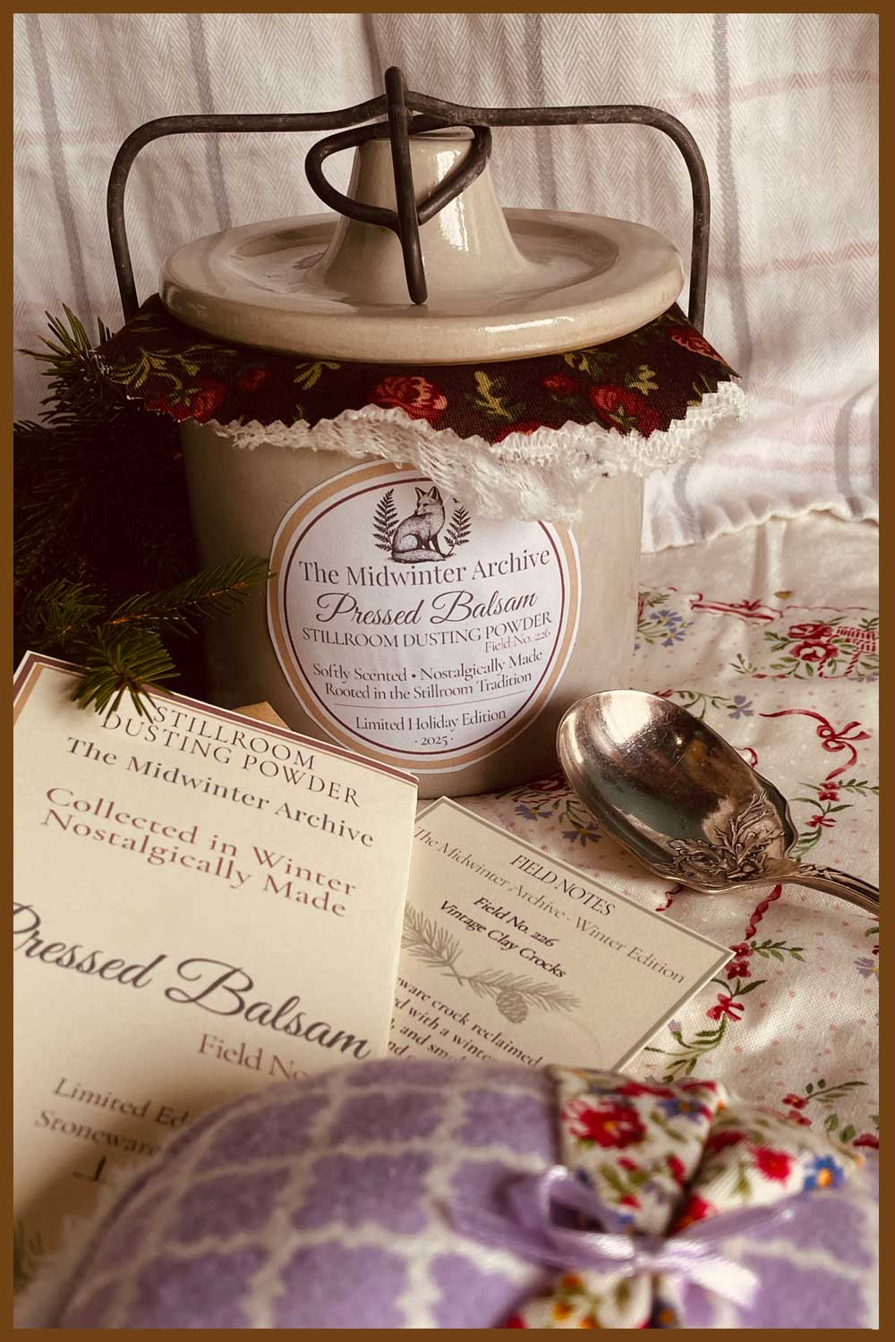 Midwinter Powder Crock beside field notes, handmade puff, and silver spoon — a slow Christmas ritual from the farmhouse stillroom.