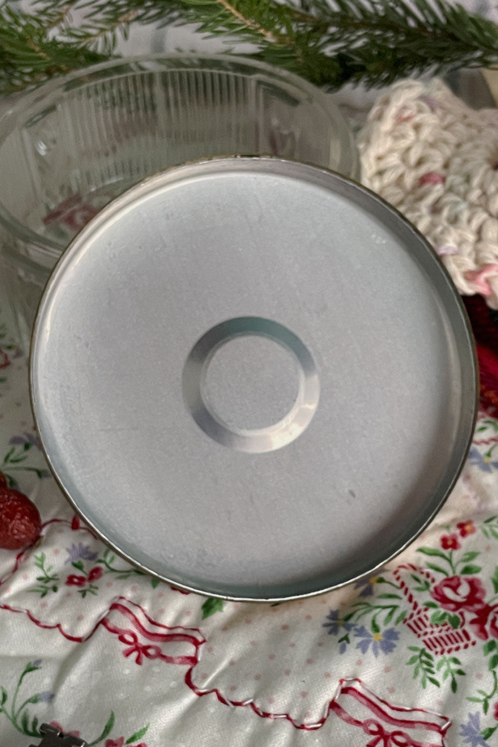 Interior view of vintage pressed-glass powder jar and brass lid, shown in a cozy Christmas stillroom setting — perfect vessel for handmade Stillroom dusting powders like Lavender Dragée.
