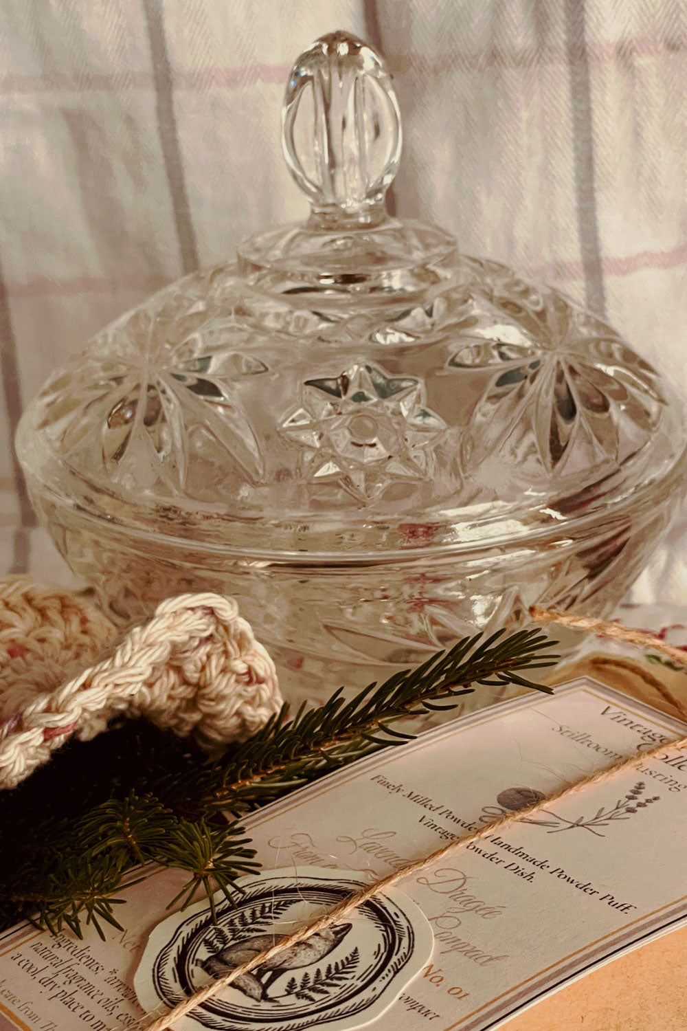 Vintage Anchor Hocking ‘Star of David’ pressed glass powder dish with ornate lid, styled on winter quilt with evergreen sprig and Stillroom Archive cards — Christmas vintage vanity gift.