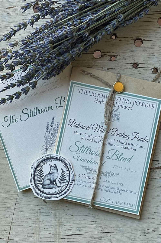 Field No. 102 Stillroom Blend Unadorned Dusting Powder — unscented sample in kraft coin envelope with brass clasp, twine, and fox seal. Herb & Oil Infused talc-free body powder, part of the Stillroom Archive Collection.