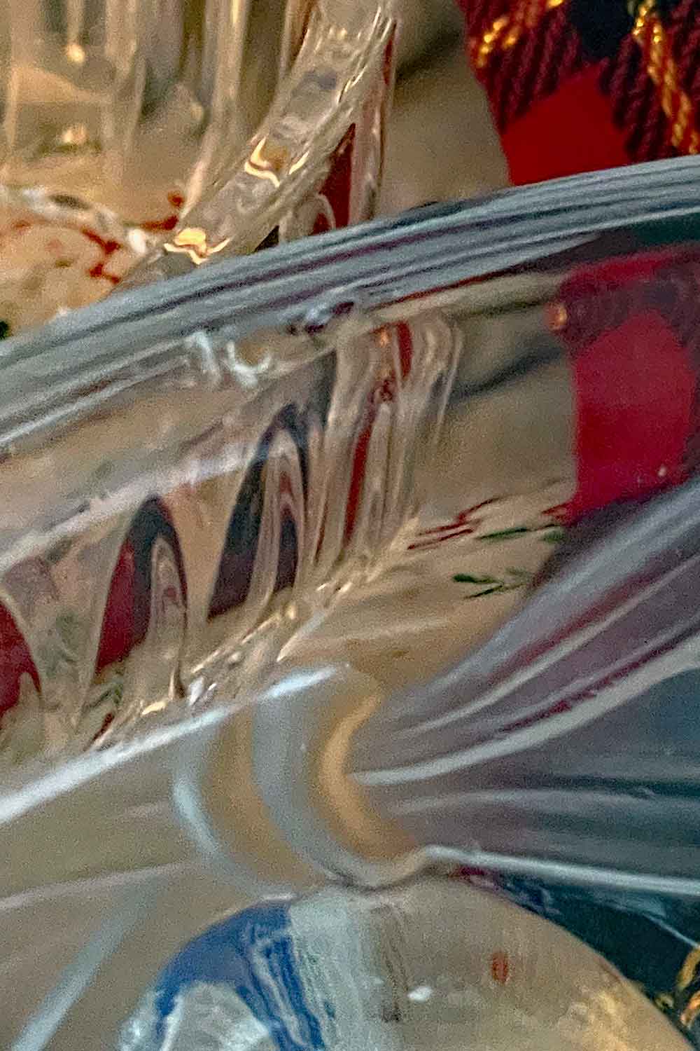 Close-up of Studio Nova vintage powder dish lid showing two small professionally smoothed rim nicks, preserved in safe vintage condition.