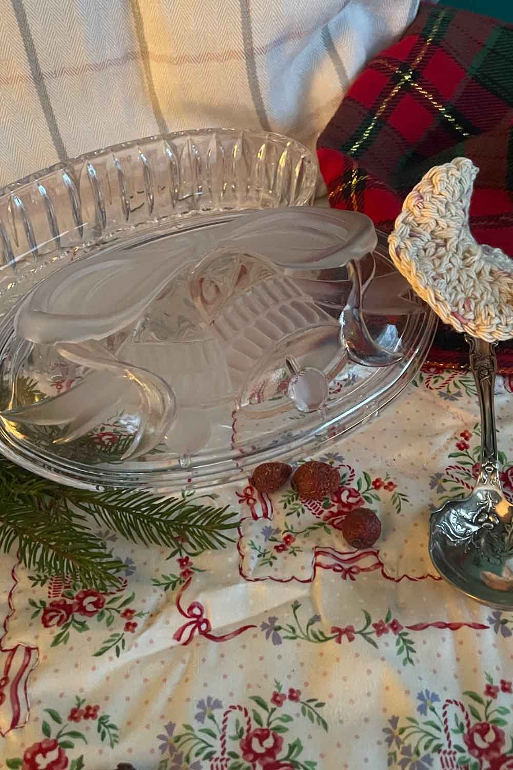 Vintage Studio Nova pressed-glass powder dish with holiday bell motif, filled with handmade Lavender Dragée dusting powder and puff, photographed on a soft stillroom backdrop.