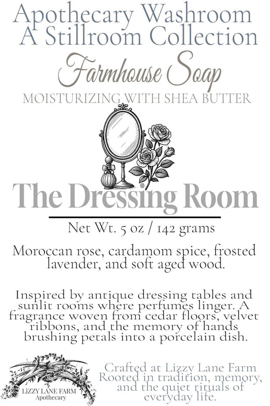 Hover card for The Dressing Room soap from the Apothecary Washroom Collection. Features scent notes of Moroccan rose, cardamom, lavender, and aged oak, with a story of antique dressing tables and quiet memories. Includes a vintage mirror line illustration and Lizzy Lane Farm branding.
