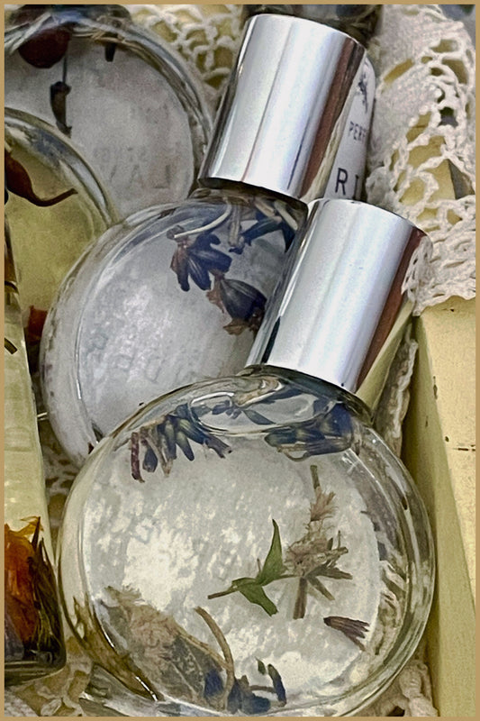 The Old Arm Chair Perfume bottle with silver cap and botanical elements in a decorative box