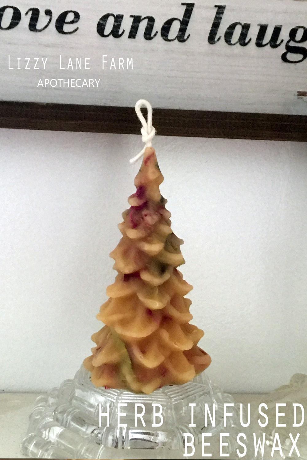 rose and bay leaf infused beeswax christmas tree candle