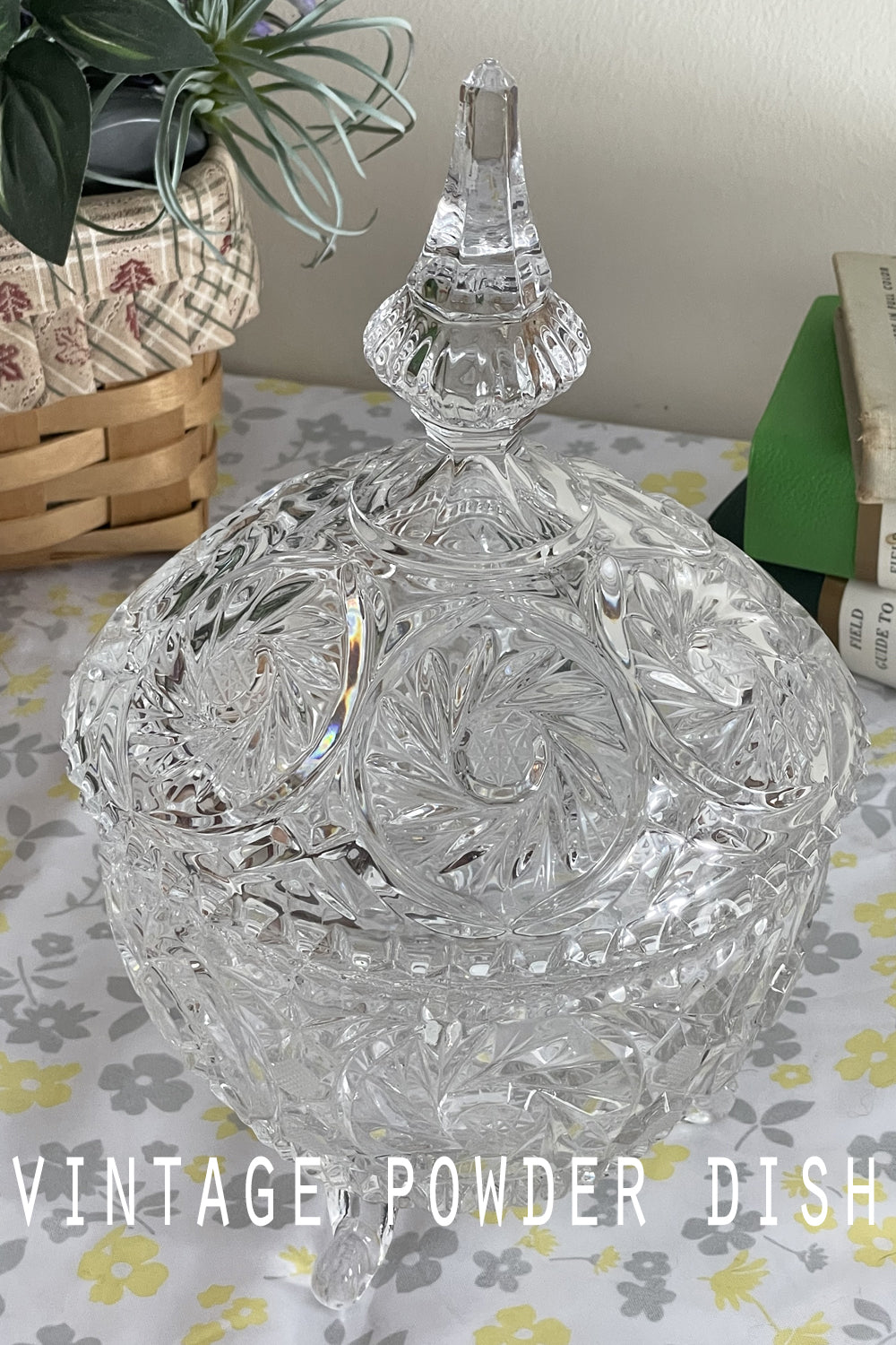 Close-up of lead crystal powder dish lid with detailed cut design, sparkling in the light.