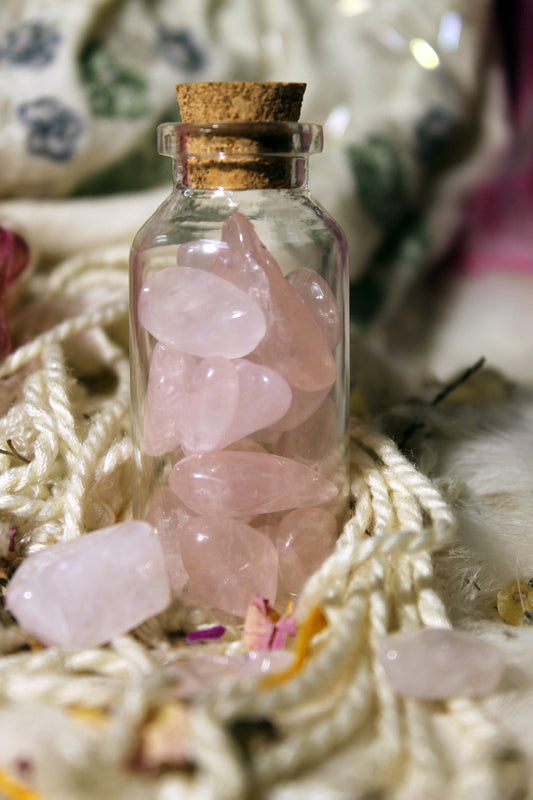 mini apothecary bottle with polished rose quarts gems