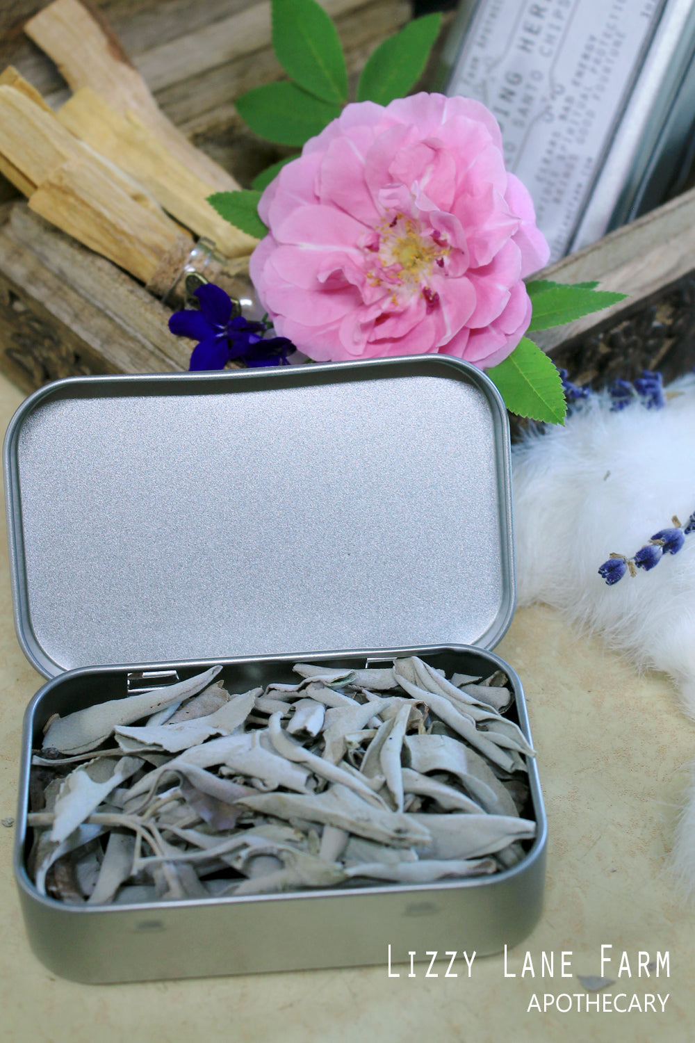 a close up of the open tin of white sage leaf